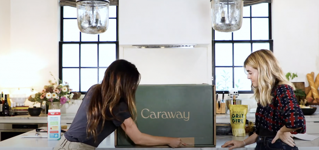 women opening Caraway box in the kitchen